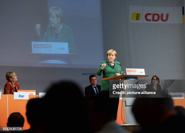 German Chancellor Angela Merkel talks at an election campaign event for the 2013 German federal elections in Heilbronn, Germany, 14 September 2013....