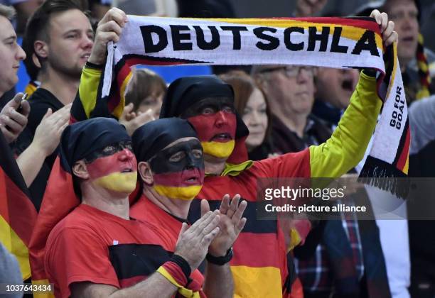 German fans cheer during the men's Handball World Cup match between Belarus and Germany in Rouen, France, 18 January 2017. Photo: Marijan Murat/dpa |...