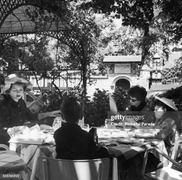 American actress Lucille Ball with her cousin Cleo Morgan and her children Lucie and Desi Jr., during a holiday at Fontainebleau near Paris, circa...
