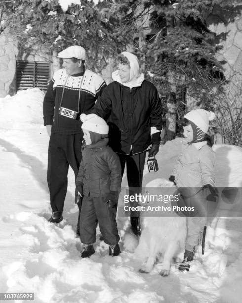 American actress Lucille Ball with her husband Desi Arnaz and their children Lucie and Desi Jr. During a holiday in the snow, circa 1957.