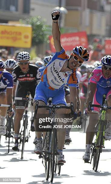 Tyler Farrar of the Garmin-Transitions team celebrates as he crosses the finish line of the five stage of the Vuelta tour of Spain in Lorca on...