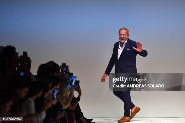 Italian fashion designer Ermanno Scervino acknowledges applause following the presentation of his Women's Spring/Summer 2019 fashion show in Milan,...