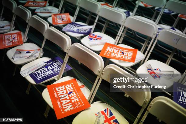 Posters, pamphlets and stickers are left out for attendees at a Leave Means Leave rally held at the University of Bolton Stadium on September 22,...