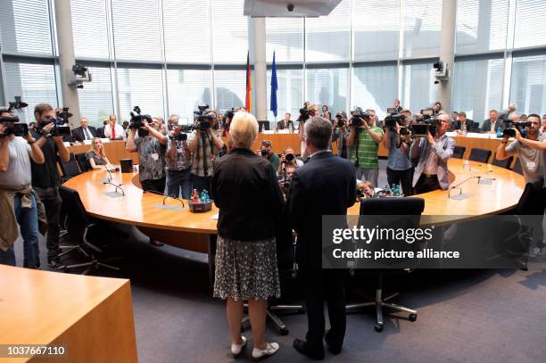 German Minister of Defence Thomas de Maiziere arrives with the committee's chairperson Susanne Kastner at today's meeting of the Euro Hawk...