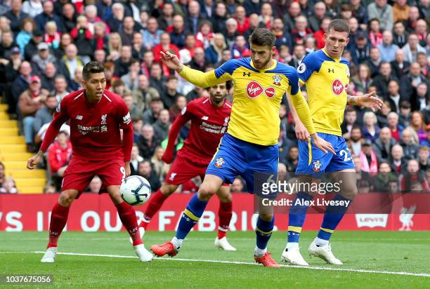Wesley Hoedt of Southampton scores an own goal for Liverpool's first goal during the Premier League match between Liverpool FC and Southampton FC at...