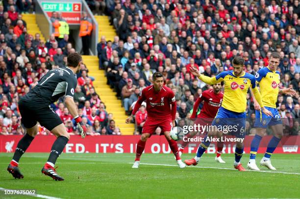 Wesley Hoedt of Southampton scores an own goal for Liverpool's first goal during the Premier League match between Liverpool FC and Southampton FC at...