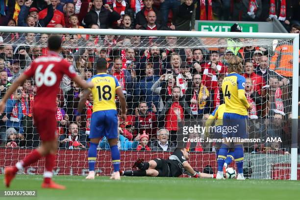Wesley Hoedt of Southampton scores an own goal during the Premier League match between Liverpool FC and Southampton FC at Anfield on September 22,...