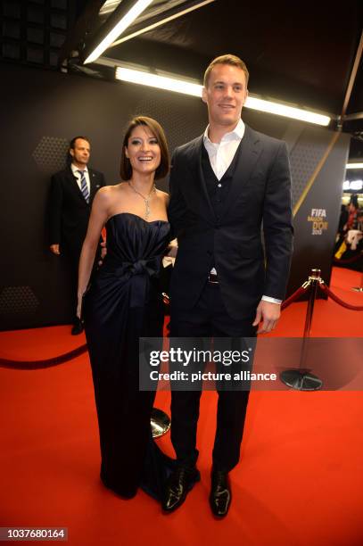 German national soccer goalkeeper Manuel Neuer and his partner Kathrin Gilch arrive at the FIFA Ballon d'Or Gala 2013 held at Kongresshaus Zurich in...