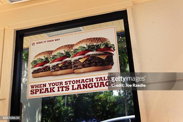 Sign hangs on the window of a Burger King restaurant as reports indicate the company may be considering a sale of itself on September 1, 2010 in...