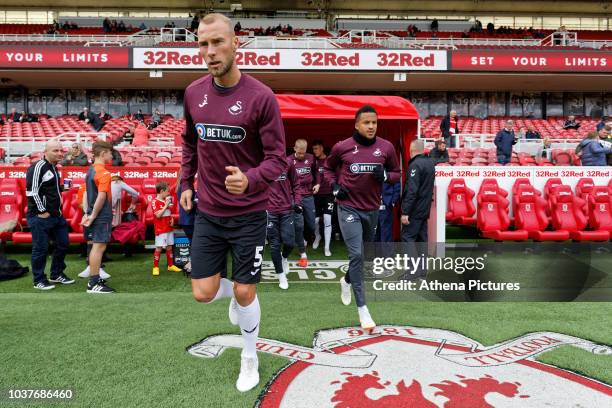 Mike van and Martin Olsson of Swansea City exit the tunnel during the Sky Bet Championship match between Middlesbrough and Swansea City at the...