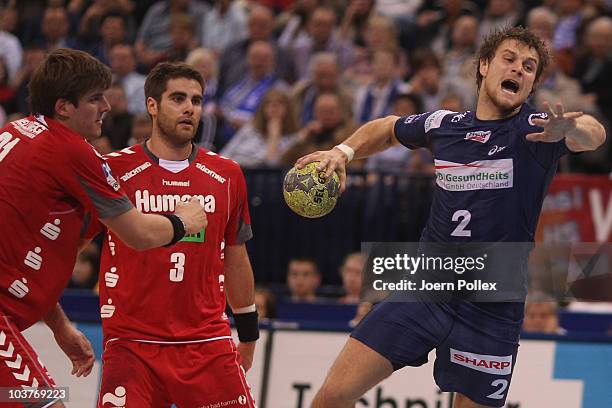 Michael Kraus of Hamburg scores during the Toyota Handball Bundesliga match between HSV Hamburg and HSG Ahlen-Hamm at the o2 World Arena on September...