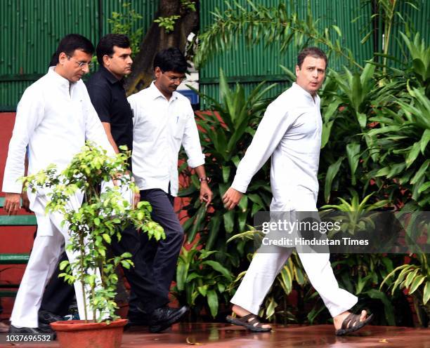 Congress Party president Rahul Gandhi with spokesperson Randeep Singh Surjewala leave after addressing media personnel on the Rafale Scam issue at...