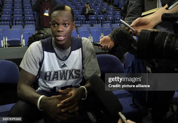 German professional basketball player Dennis Schroeder of the NBA team Atlanta Hawks talks to journalists during his team's training at O2 Arena in...