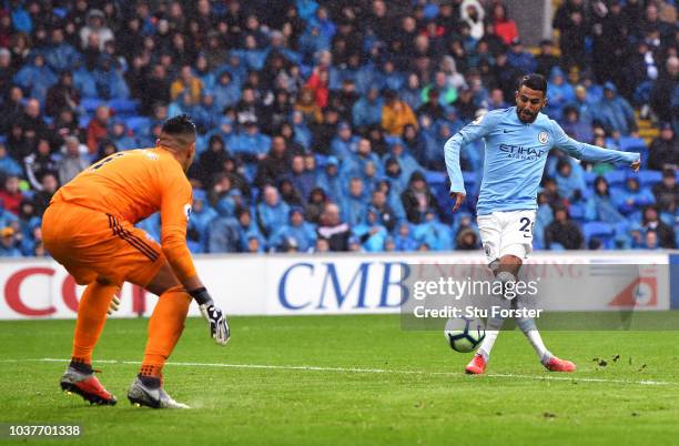 Riyad Mahrez of Manchester City scores his team's fourth goal during the Premier League match between Cardiff City and Manchester City at Cardiff...