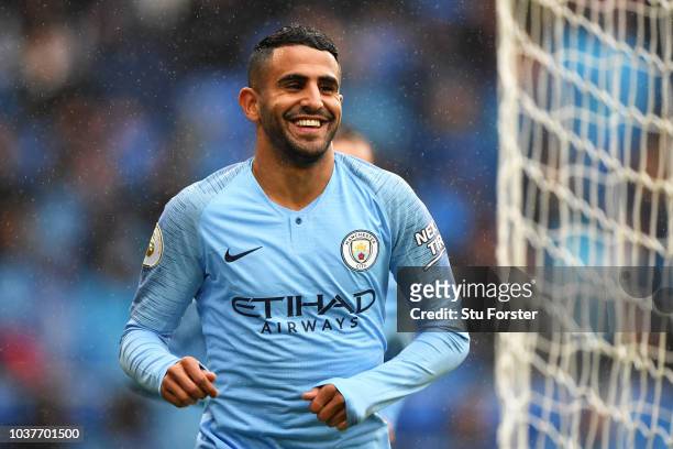 Riyad Mahrez of Manchester City celebrates after scoring his team's fourth goal during the Premier League match between Cardiff City and Manchester...
