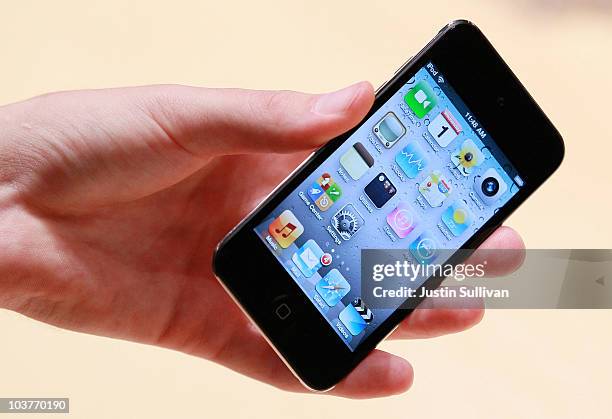 An Apple employee holds a new iPod Touch at an Apple Special Event at the Yerba Buena Center for the Arts September 1, 2010 in San Francisco,...
