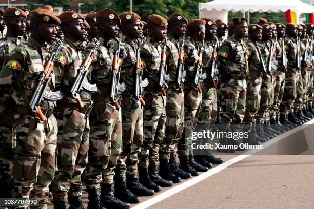 Malian army soldiers get ready ahead of the National Day military parade on September 22, 2018 in Bamako, Mali.