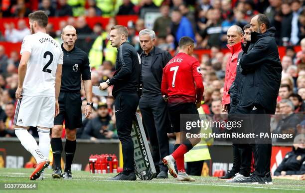 Manchester United's Alexis Sanchez is substituted off by Manchester United manager Jose Mourinho during the Premier League match at Old Trafford,...