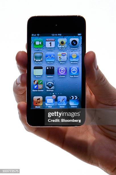 The new Apple Inc. IPod Touch is displayed during an Apple product unveiling event in San Francisco, California, U.S., on Wednesday, Sept. 1, 2010....