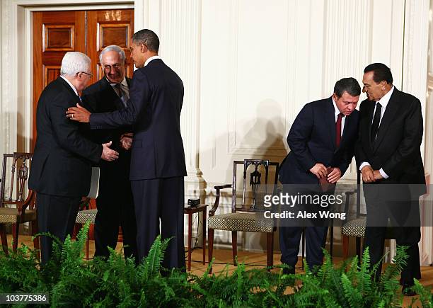 President Barack Obama shakes hands with Palestinian Authority President Mahmoud Abbas and Israeli Prime Minister Benjamin Netanyahu as King Abdullah...