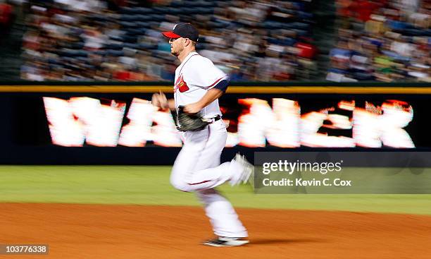 Closer Billy Wagner of the Atlanta Braves runs to the pitching mound to start the ninth inning against the New York Mets at Turner Field on September...