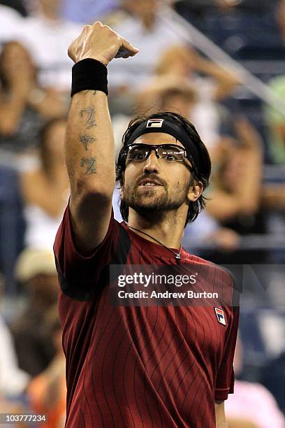 Janko Tipsarevic of Serbia celebrates winning the third set against Andy Roddick of the United States during his second round men's singles match on...