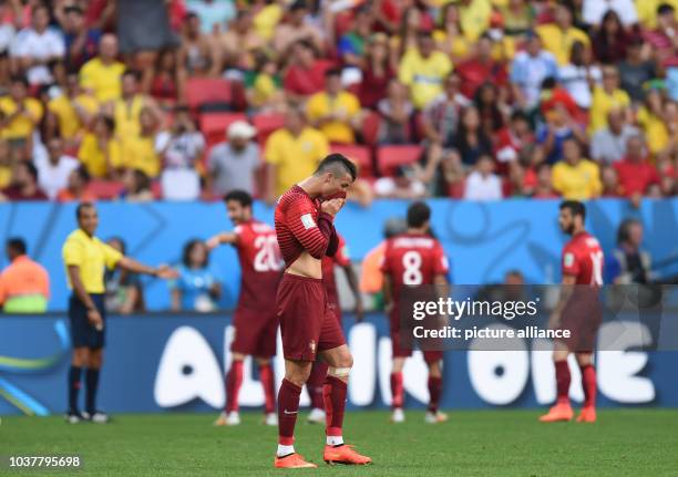 Cristiano Ronaldo of Portugal reacts during the FIFA World Cup 2014 group G preliminary round match between Portugal and Ghana at the Estadio...