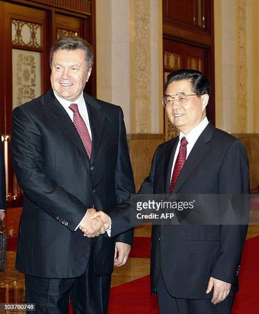 Chinese President Hu Jintao shakes hands with Ukrainian President Viktor Yanukovych in Beijing on September 2, 2010 during Yanukovych's visit to...