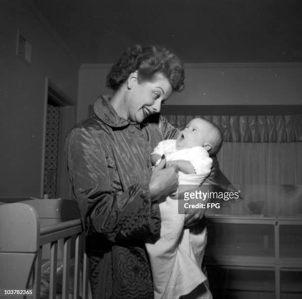American actress Lucille Ball at home with her son Desi Arnaz Jr., 1953.