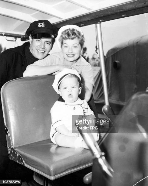American actress Lucille Ball with her husband Desi Arnaz and their daughter Lucie on board their boat, the 'Desilu', circa 1954.