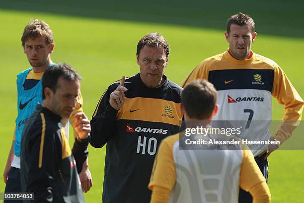 Holger Osieck, head coach of team Australia gives instructions to his players during an Australian Socceroos training session at the AFG Arena on...