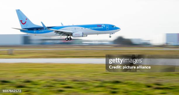 New Boeing 737-800 aircraft of the airline TuiFly flies over the runway at the airport in Hanover, Germany, 17 February 2014. TuiFly aircrafts will...