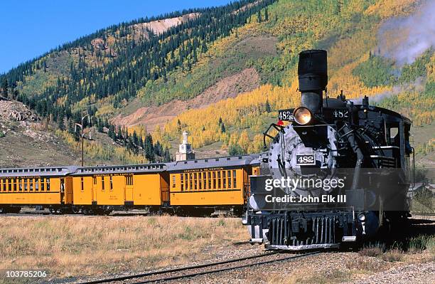 steam train leaving town on durango and silverton narrow gauge railroad. - treno a vapore foto e immagini stock