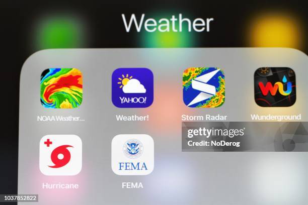 various weather mobile internet apps on an ipad screen - meteorological organization stock pictures, royalty-free photos & images