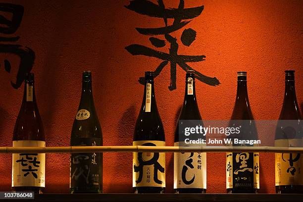 sake bottles outside restaurant. - saké photos et images de collection