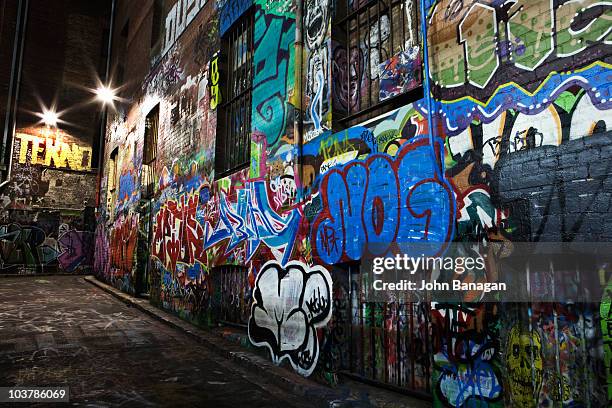 graffiti/street art site at night, hosier lane area. - graffiti wall stock pictures, royalty-free photos & images