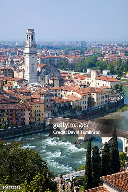 overview of verona from terrace of castel san pietro across river adige, with tower of duomo cathedral and ponte pietra bridge prominent. - verona italy stock pictures, royalty-free photos & images