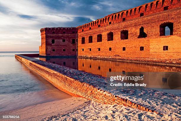 moat wall of fort jefferson in late afternoon light. - moat stockfoto's en -beelden