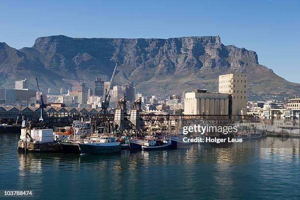 fishing boats, waterfront and table mountain. - table mountain cape town stock pictures, royalty-free photos & images