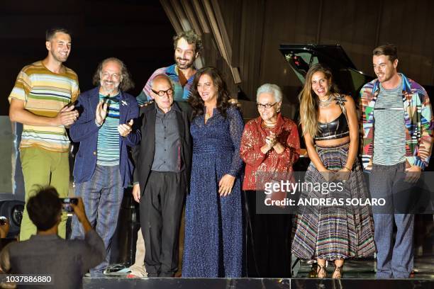 Italia fashion designer Rosita Missoni , her daughter Angela Missoni , her son Luca Missoni and relatives, and English pianist Michael Nyman...