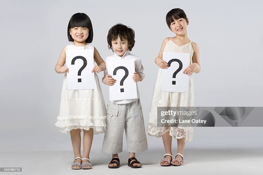 Questioning Child Image Children Holding Signs With Question Marks High-Res Stock Photo - Getty ...