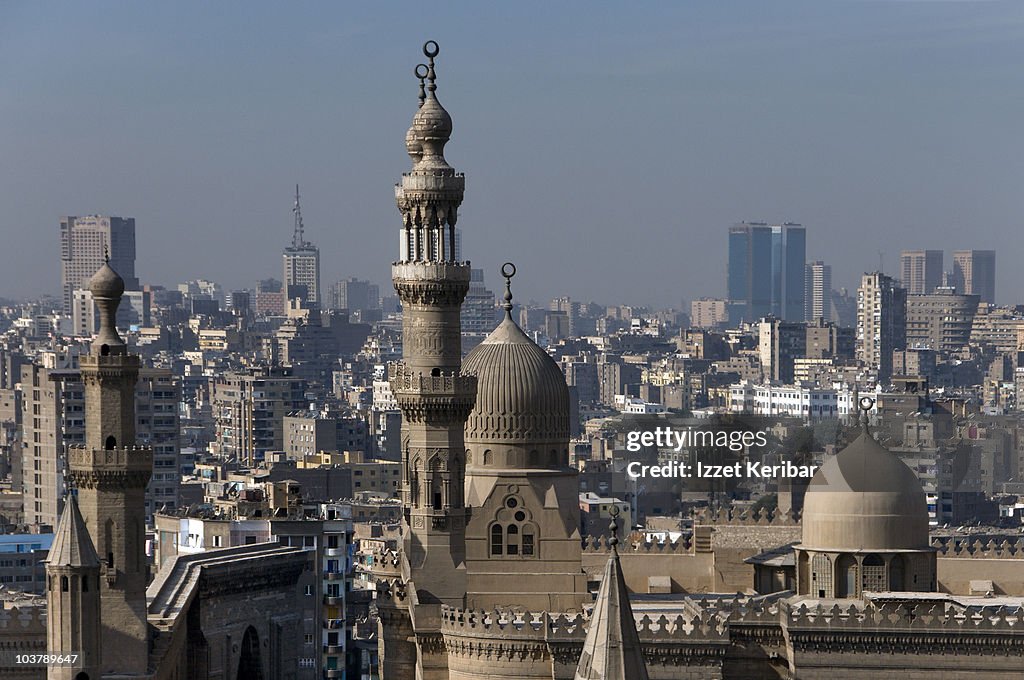 Ar-Rifai Mosque and Mosque of Sultan Hassan (Midan Salah ad-Din) with city buildings in background.