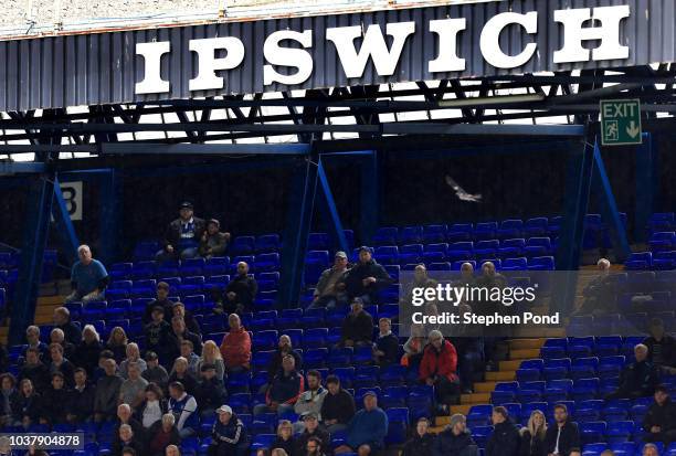 Ipswich Town fans sit amongst empty seats during the Sky Bet Championship match between Ipswich Town and Bolton Wanderers at Portman Road Stadium on...