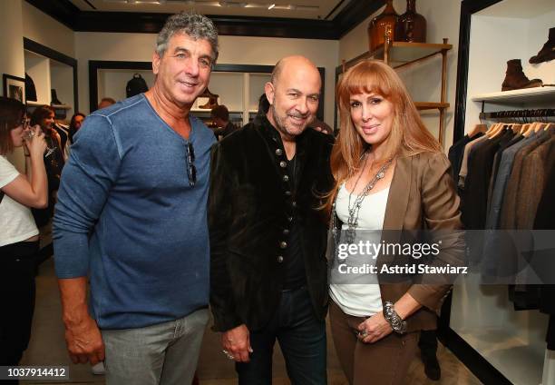 Mark Henkin, John Varvatos and Julie Lamb attend the John Varvatos Madison Avenue Store Personal Appearance on September 22, 2018 in New York City.