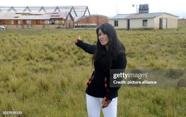 El Alto city councilwoman Wilma Alanoca points to the area where Russian corporation Rosatom will help build South America's largest nuclear centre...