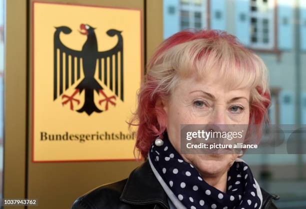 Elisabeth S., plaintiff in a civil suit for pain and suffering against TUEV Rheinland concerning breast implants with inferior silicone, waits for...