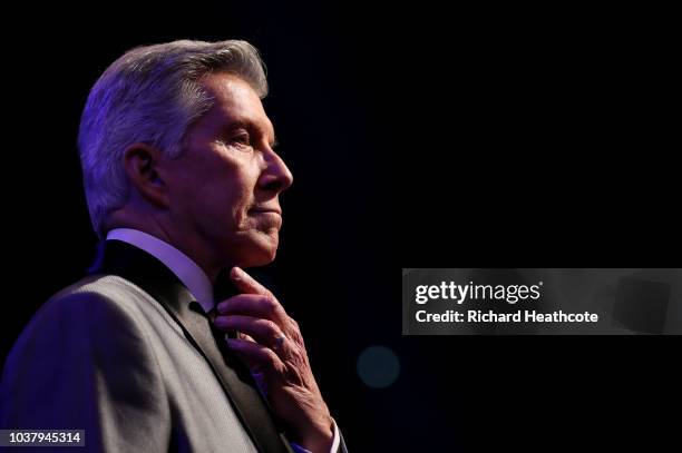 Michael Buffer, ring announcer looks on inside the ring prior to the BF, WBA Super, WBO & IBO World Heavyweight Championship title fight between...