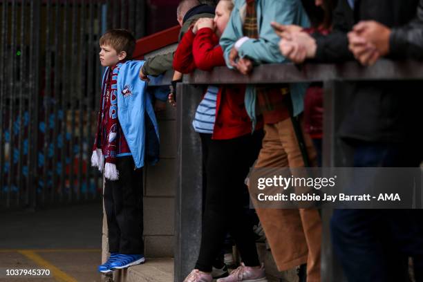 Young fan of Scunthorpe United looks on during the Sky Bet League One match between Scunthorpe United and Shrewsbury Town at Glanford Park on...