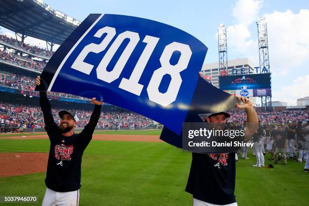 Ender Inciarte and Charlie Culberson of the Atlanta Braves celebrate after clinching the NL East Division against the Philadelphia Phillies at...