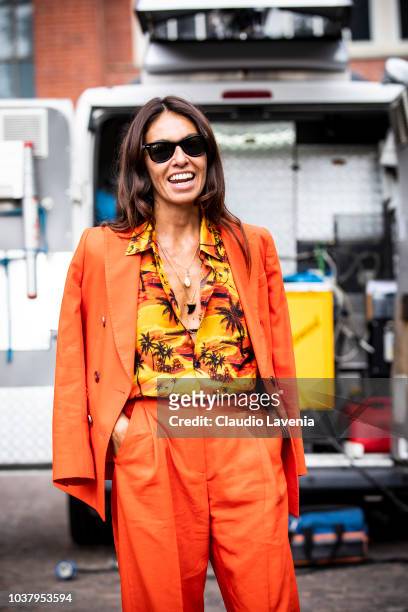 Viviana Volpicella, wearing Balenciaga shirt and Alberto Biani orange suit, is seen before the Philosophy by Lorenzo Serafini show, during Milan...